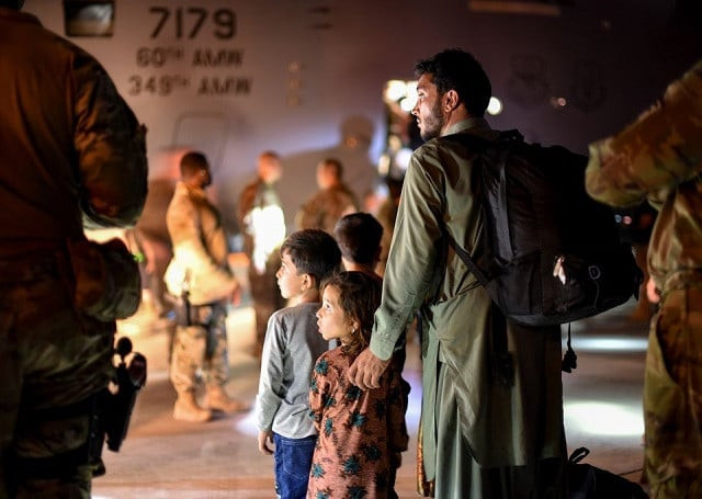 a father and children evacuees from afghanistan leave a us c 17 globemaster transport plane after arriving at ali al salem air base kuwait august 24 2021 us air force staff sgt photo reuters a father and children evacuees from afghanistan leave a us c 17 globemaster transport plane after arriving at ali al salem air base kuwait august 24 2021 us air force staff sgt photo reuters