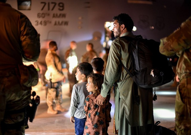 a father and children evacuees from afghanistan leave a us c 17 globemaster transport plane after arriving at ali al salem air base kuwait august 24 2021 us air force staff sgt photo reuters