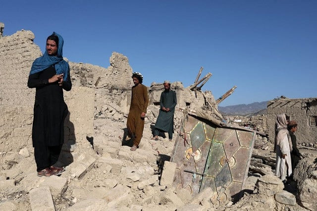 afghan men stand on the debris of damaged houses after the recent earthquake in wor kali village in the barmal district of paktika province afghanistan june 25 2022 photo reuters afghan men stand on the debris of damaged houses after the recent earthquake in wor kali village in the barmal district of paktika province afghanistan june 25 2022 photo reuters