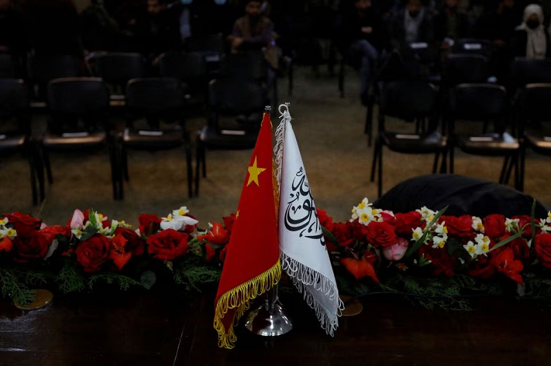 the flags of the china and the islamic emirate of afghanistan are displayed during a news conference in kabul afghanistan january 5 2023 photo reuters