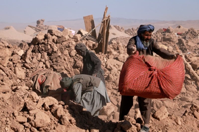afghans clear debris of damaged houses after an earthquake that hit herat province s zenda jan district photo afp