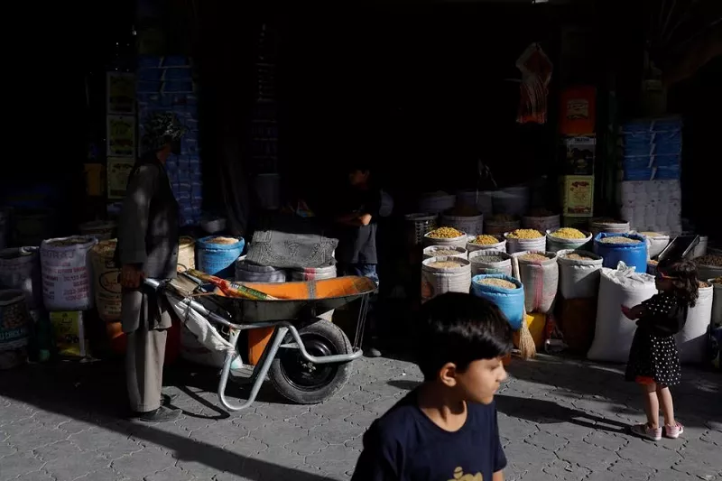 baba karim with his wheelbarrow stands next to a shop in kabul afghanistan september 3 2023 photo reuters baba karim with his wheelbarrow stands next to a shop in kabul afghanistan september 3 2023 photo reuters