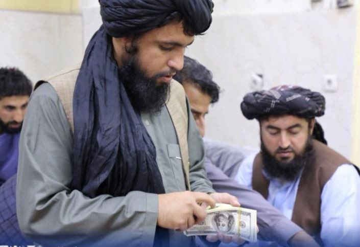 men are pictured as afghanistan s taliban controlled central bank seizes a large amount of money in cash and gold from former top government officials including former vice president amrullah saleh in afghanistan in this handout obtained by reuters on september 15 2021 photo reuters