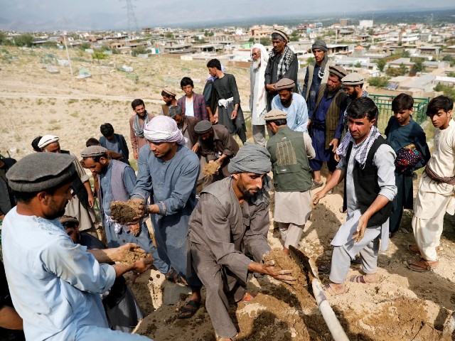 relatives take part in a burial ceremony of two victims of wednesday s floods in charikar capital of parwan province afghanistan august 27 2020 photo reuters file