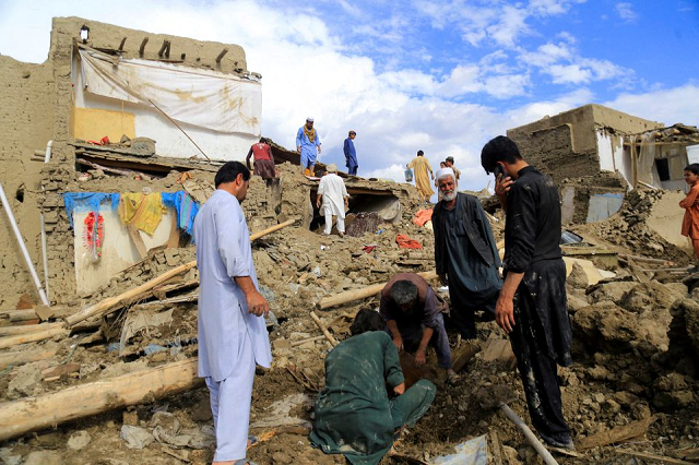 people clean up their damaged homes after the heavy flood in the khushi district of logar afghanistan august 21 2022 photo reuters people clean up their damaged homes after the heavy flood in the khushi district of logar afghanistan august 21 2022 photo reuters