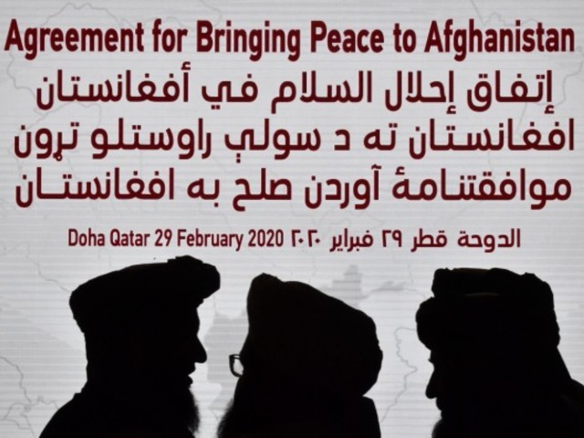 taliban members gather ahead of the signing ceremony with the us in the qatar in february photo afp file