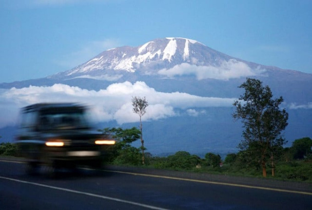 a vehicle drives past mount kilimanjaro in tanzania s hie district file reuters katrina manson a vehicle drives past mount kilimanjaro in tanzania s hie district file reuters katrina manson