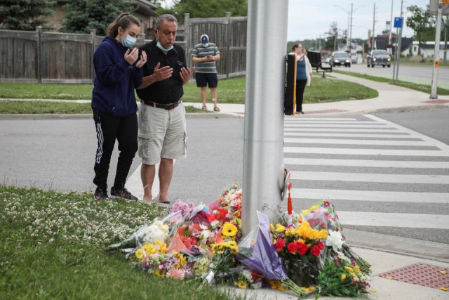 abdullah alzureiqi and his daughter hala say a prayer at the fatal crime scene where a man driving a pickup truck jumped the curb and ran over a muslim family in what police say was a deliberately targeted anti islamic hate crime in london ontario canada june 7 2021 photo reuters abdullah alzureiqi and his daughter hala say a prayer at the fatal crime scene where a man driving a pickup truck jumped the curb and ran over a muslim family in what police say was a deliberately targeted anti islamic hate crime in london ontario canada june 7 2021 photo reuters
