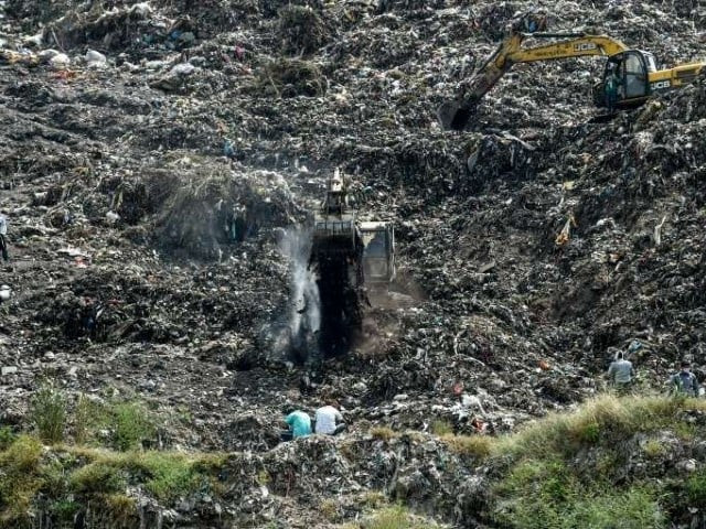 rescuers searching the pirana landfill in ahmedabad for neha vasava 12 who was buried while rag picking on the garbage dump photo afp rescuers searching the pirana landfill in ahmedabad for neha vasava 12 who was buried while rag picking on the garbage dump photo afp