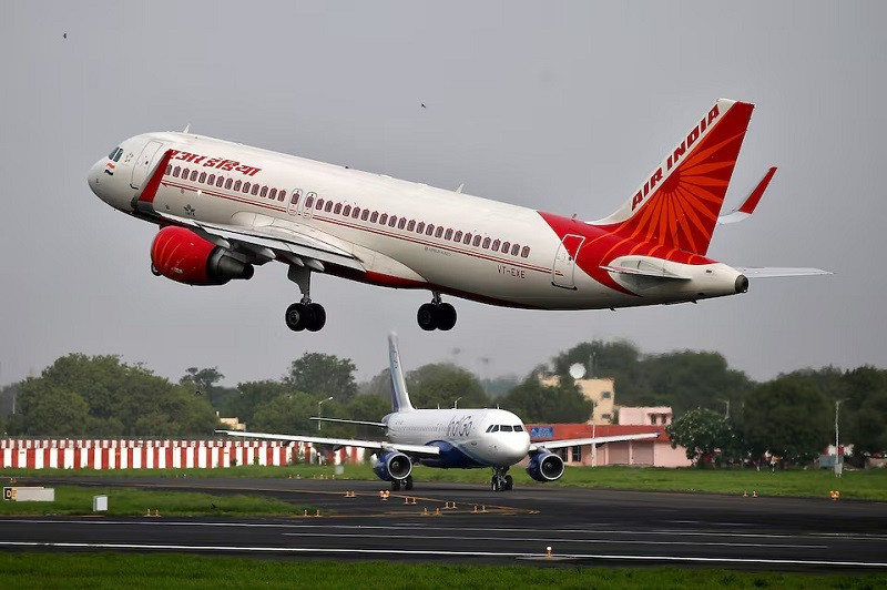 An Air India aircraft takes off as an IndiGo aircraft waits for clearance at the Sardar Vallabhbhai Patel International Airport in Ahmedabad, India, July 7, 2017. PHOTO: REUTERS