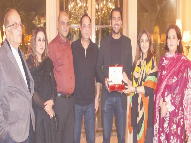 sop chairperson ronak lakhani presents a souvenir to pakistan s top tennis star and poa associate secretary general aisam u haq at a reception on wednesday poa s majid wasim tehmina asif asma hassan waseem hashmi and asif azeem are also seen photo sop