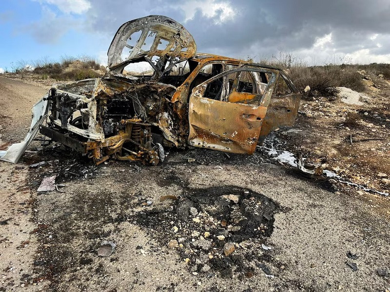 Al Jazeera's burnt out car is seen on October 15, 2023, at the site near the village of Alma al-Chaab, Lebanon, where Reuters visual journalist Issam Abdallah was killed when a tank round hit him October 13, 2023 while he was filming cross-border shelling. PHOTO: REUTERS