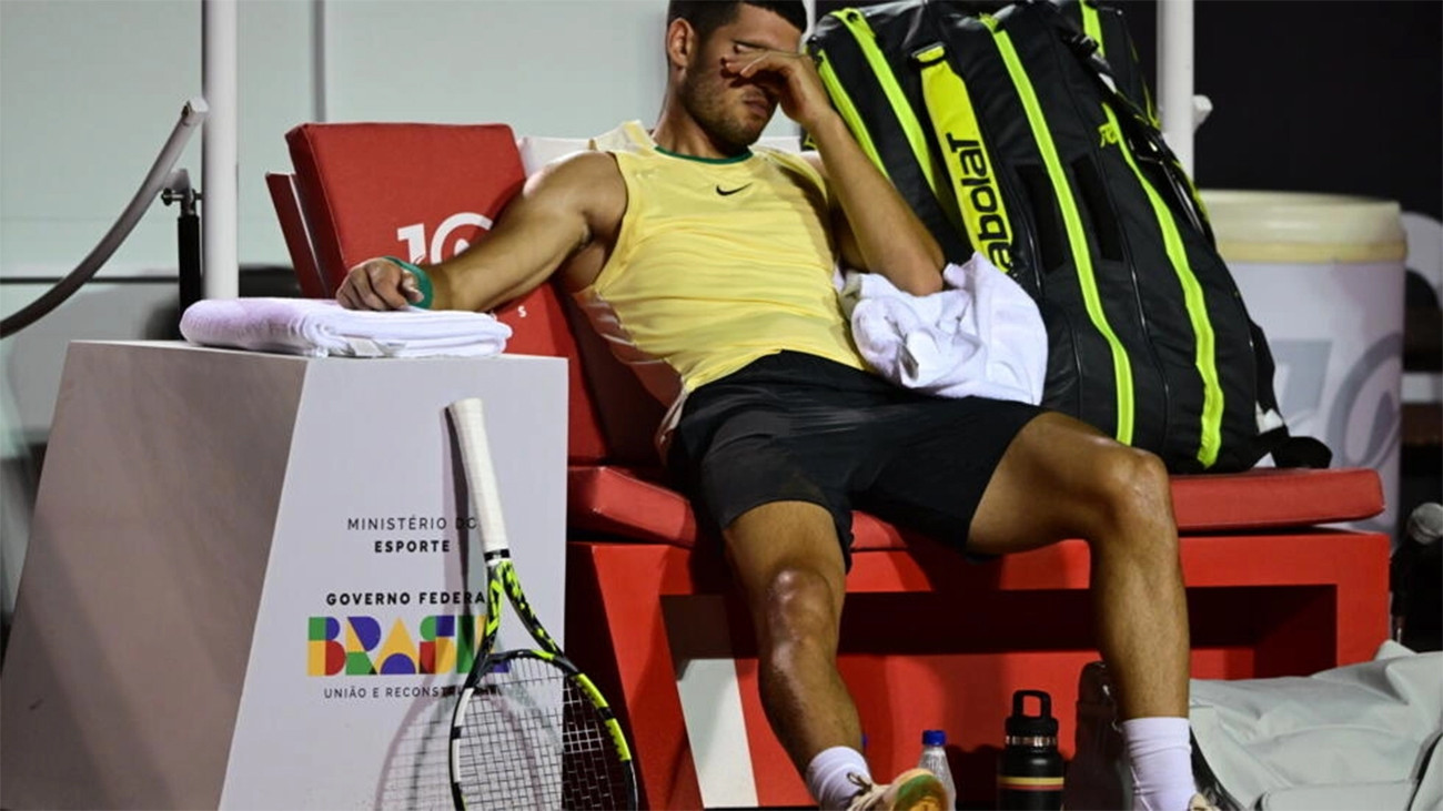 unfortunate spain s carlos alcaraz gestures after suffering an ankle injury in his atp rio open first round match against thiago monteiro photo afp