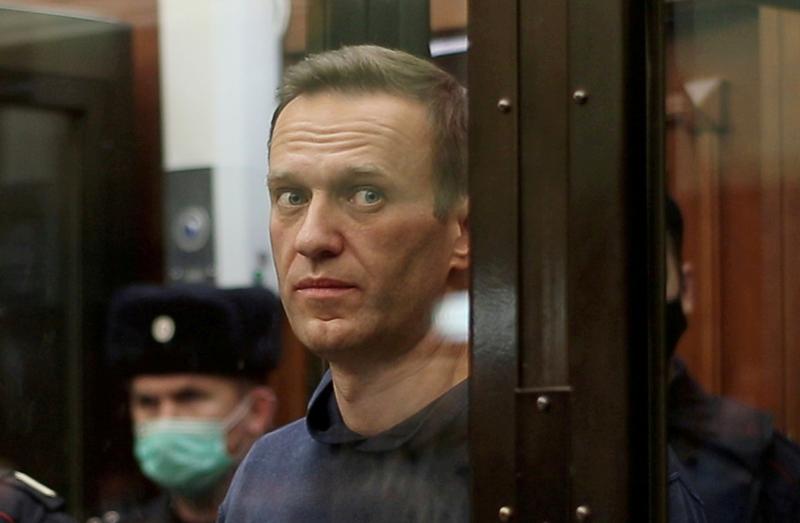 a still image taken from video footage shows russian opposition leader alexei navalny who is accused of flouting the terms of a suspended sentence for embezzlement inside a defendant dock during the announcement of a court verdict in moscow russia february 2 2021 photo reuters file