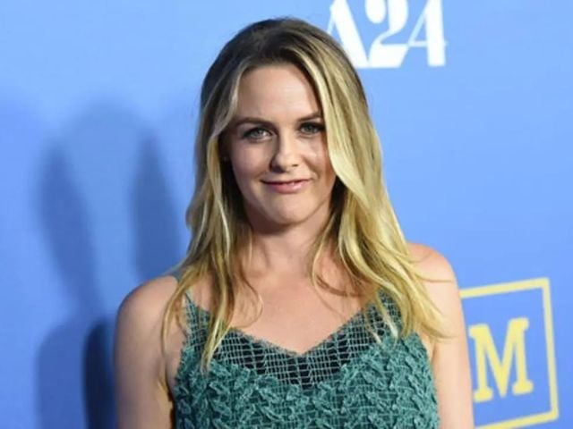 Fans express concern after Alicia Silverstone appears to eat potentially poisonous fruit in a TikTok video