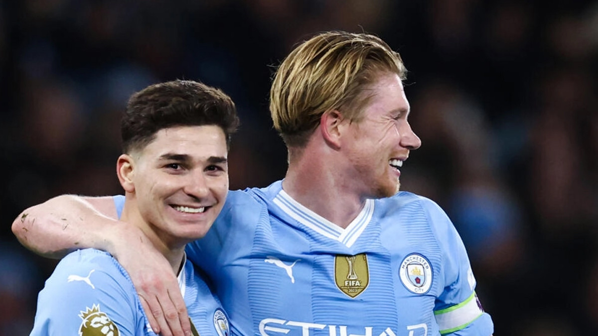 manchester city s julian alvarez l celebrates with kevin de bruyne photo afp