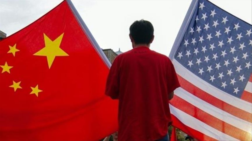 Three accused of harassing Chinese fugitive in US head to trial