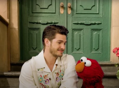 andrew garfield talks about grief and his late mother in heartwarming video with elmo