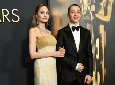 knox jolie pitt joins angelina jolie on governor s awards red carpet after 3 year hiatus
