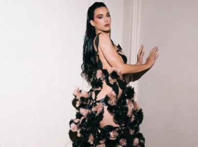 katy perry reveals woman s world lyrics on dress train in paris