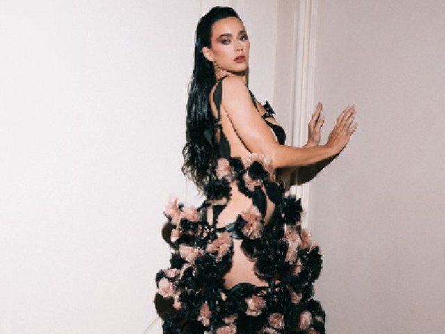 katy perry reveals woman s world lyrics on dress train in paris katy perry reveals woman s world lyrics on dress train in paris