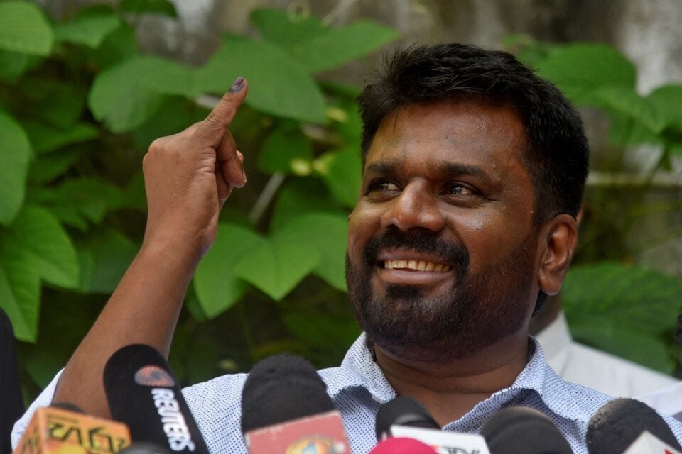 anura kumara dissanayake the presidential candidate from national people s power shows his ink marked finger after casting his vote at a polling station on the day of the presidential election in colombo sri lanka on september 21 2024 photo reuters