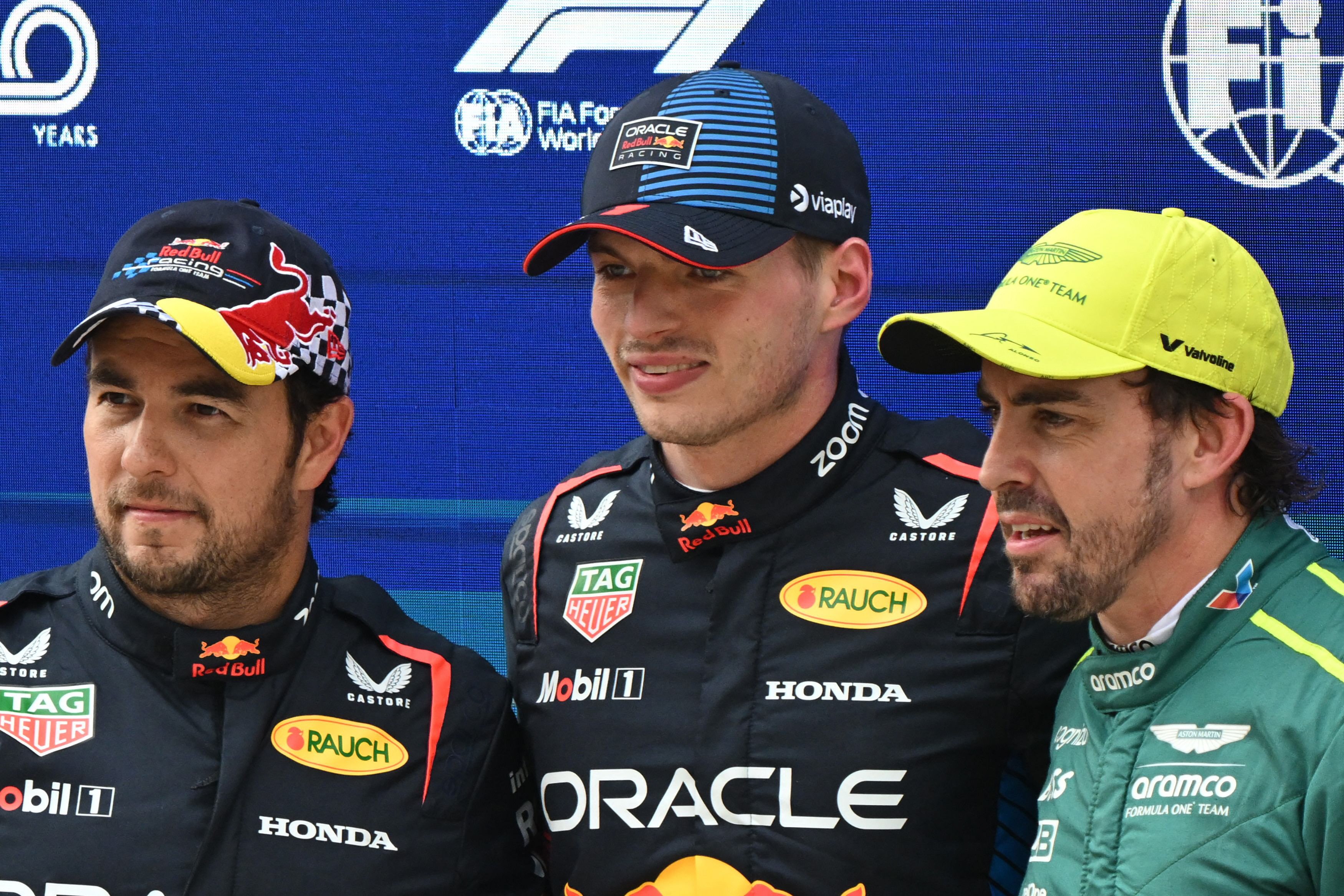 resounding lead l r red bull racing s mexican driver sergio perez red bull racing s dutch driver max verstappen and aston martin s spanish driver fernando alonso pose after the qualifying session for the formula one chinese grand prix at the shanghai international circuit in shanghai photo afp