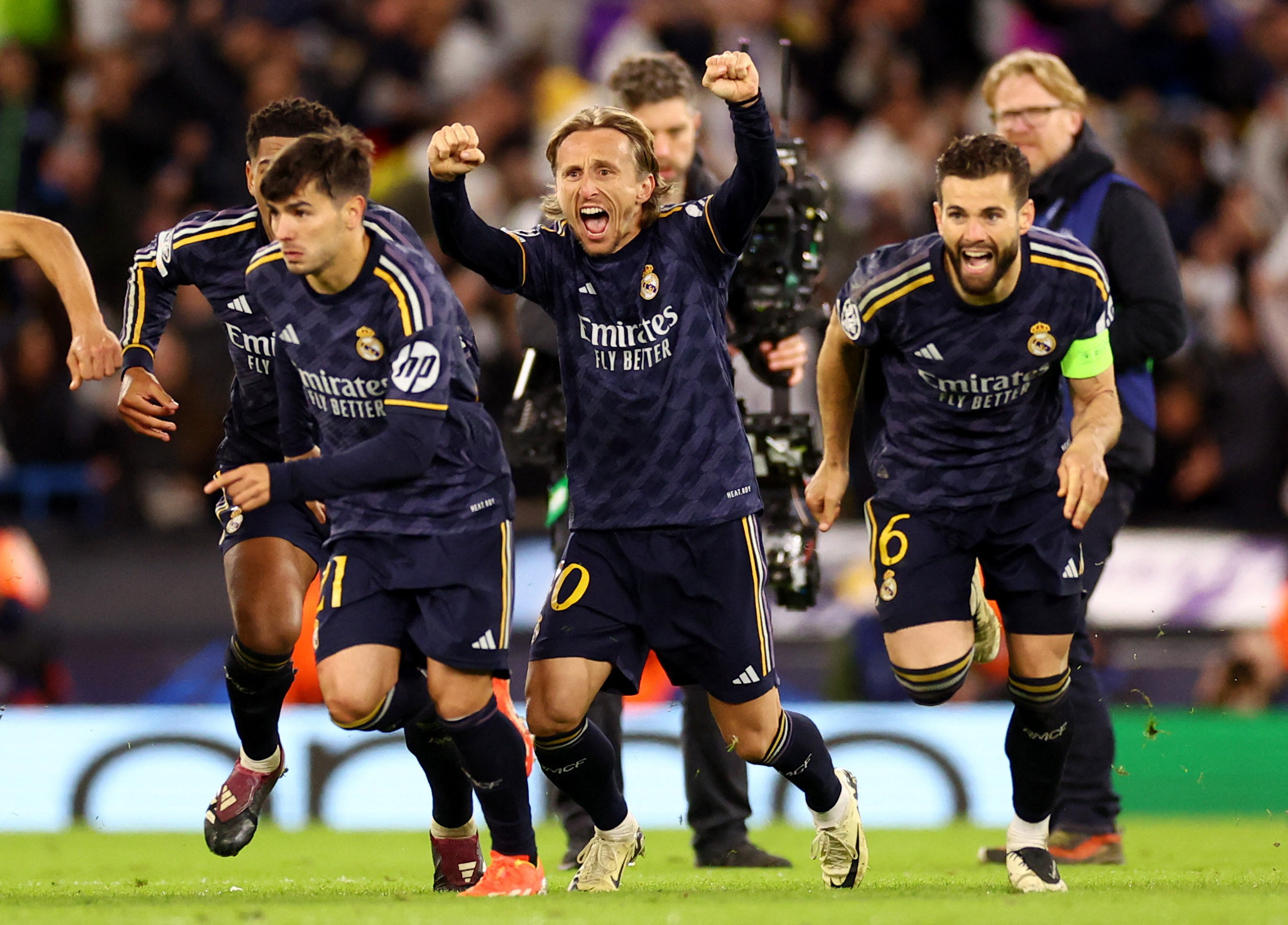 sweet victory real madrid s luka modric and teammates celebrate winning the penalty shootout against manchester city fc during the uefa champions league quarterfinal second leg at etihad stadium photo reuters