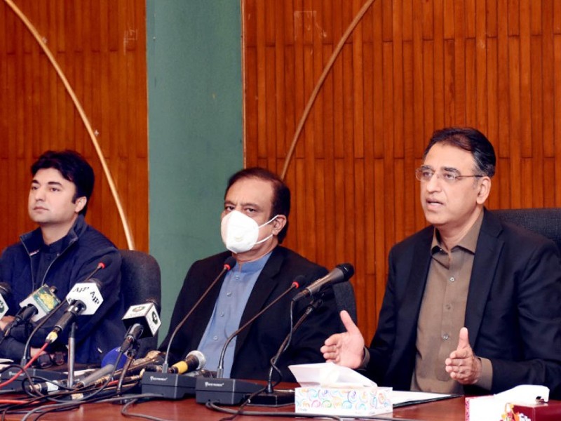 federal minister for planning development and special initiatives asad umar along with federal minister for information and broadcasting senator shibli faraz federal minister for communication murad saeed addressing a press conference in islamabad on november 19 2020 photo pid