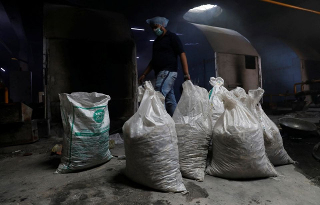 bags containing unclaimed ashes of victims who died from the coronavirus disease covid 19 are seen at a crematorium in new delhi india may 9 2021 picture taken may 9 2021 photo reuters bags containing unclaimed ashes of victims who died from the coronavirus disease covid 19 are seen at a crematorium in new delhi india may 9 2021 picture taken may 9 2021 photo reuters