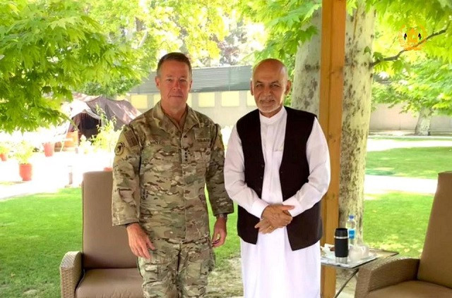 Afghanistan's President Ashraf Ghani (R) meets General Austin 