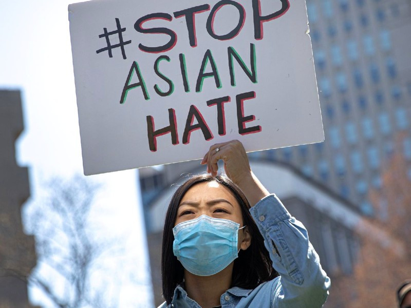 a woman holds a placard as she participates in a stop asian hate rally at columbus park in new york city us april 3 2021 photo reuters file