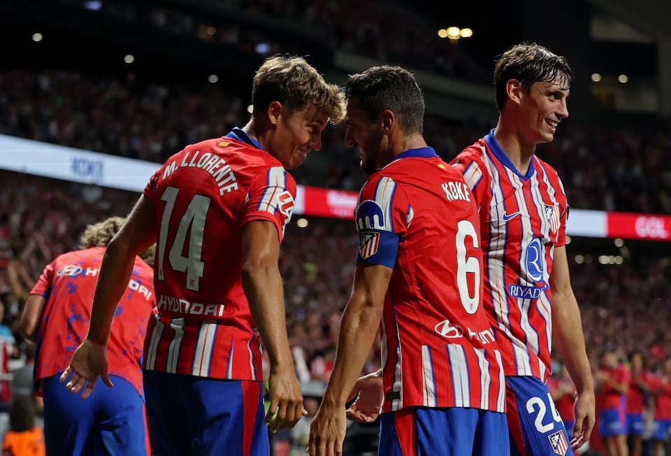 atletico madrid s koke celebrates scoring their third goal with marcos llorente in a laliga match between atletico madrid vs girona at civitas metropolitano madrid spain on august 25 2024 photo reuters