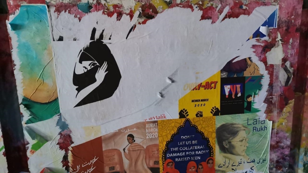 Photo: Vandalised Aurat March posters in Lahore [Amal Awais Chughtai/Al Jazeera]