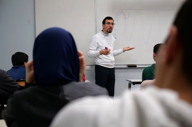 Teacher Ilyas Laarej speaks in front of middle school students during an Islamic ethics class at the Averroes school, France's biggest Muslim educational institution that has lost its state funding on grounds of administrative failures and questionable teaching practices, in Lille, France, March 19, 2024. PHOTO: REUTERS