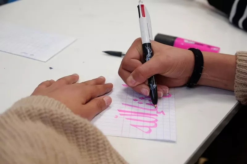 a middle school student scribbles on a piece of paper during an islamic ethics class at the averroes school in lille france march 19 2024 photo reuters