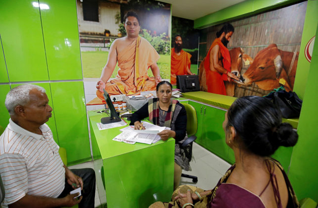 an ayurveda doctor collects her patient s history before examining her at a patanjali ayurved clinic in ahmedabad india photo reuters file