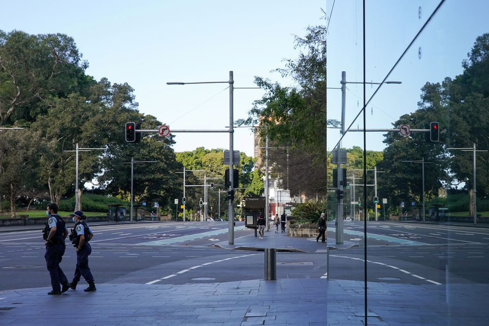 police officers patrol the quiet city centre during a lockdown to curb the spread of a coronavirus disease covid 19 outbreak in sydney australia august 18 2021 photo reuters