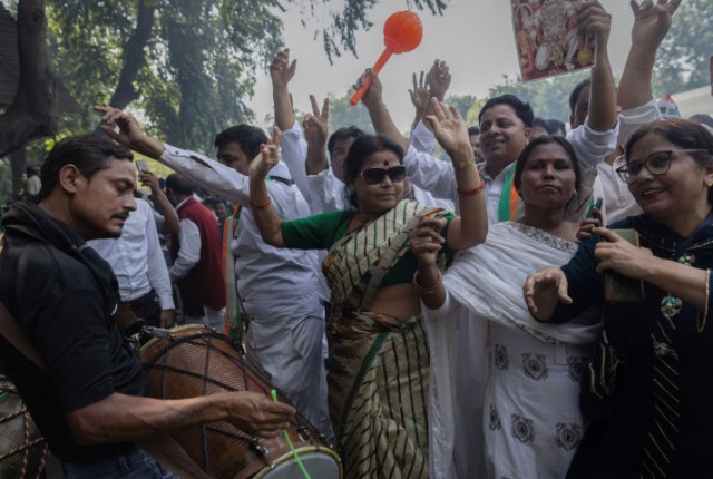 supporters of india s main opposition congress party celebrate after the initial poll results in karnataka elections at the party headquarters in new delhi india may 13 2023 reuters adnan abidi supporters of india s main opposition congress party celebrate after the initial poll results in karnataka elections at the party headquarters in new delhi india may 13 2023 reuters adnan abidi