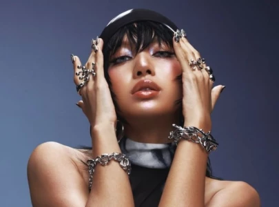 blackpink s lisa teases mystery collaboration and confirms group s return