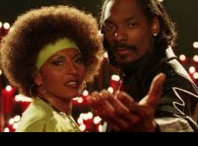 pam grier playfully spilled secrets about her bones co star snoop dogg