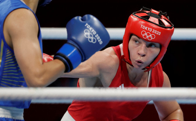 britain s lauren price in action against china s li qian in the tokyo 2020 olympics women s middleweight final at kokugikan arena in tokyo japan on august 8 2021 photo file ueslei marcelino reuters