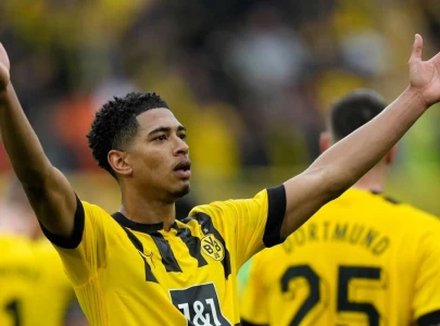 bellingham helps dortmund keep pace with bayern
