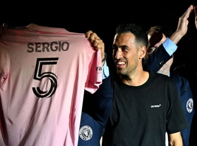 busquets inks deal to join messi