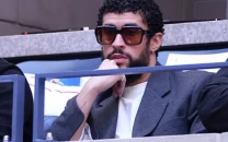 bad bunny sparks backlash for sitting during god bless america at yankee stadium bad bunny sparks backlash for sitting during god bless america at yankee stadium