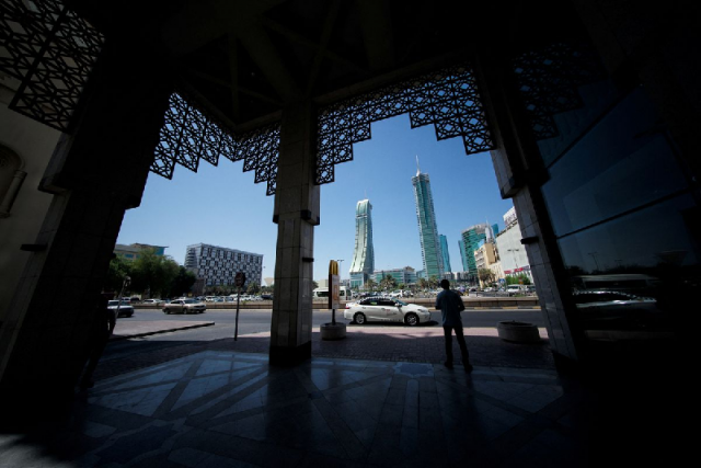 a man waits for a taxi near bahrain financial harbour manama bahrain september 23 2021 photo reuters a man waits for a taxi near bahrain financial harbour manama bahrain september 23 2021 photo reuters