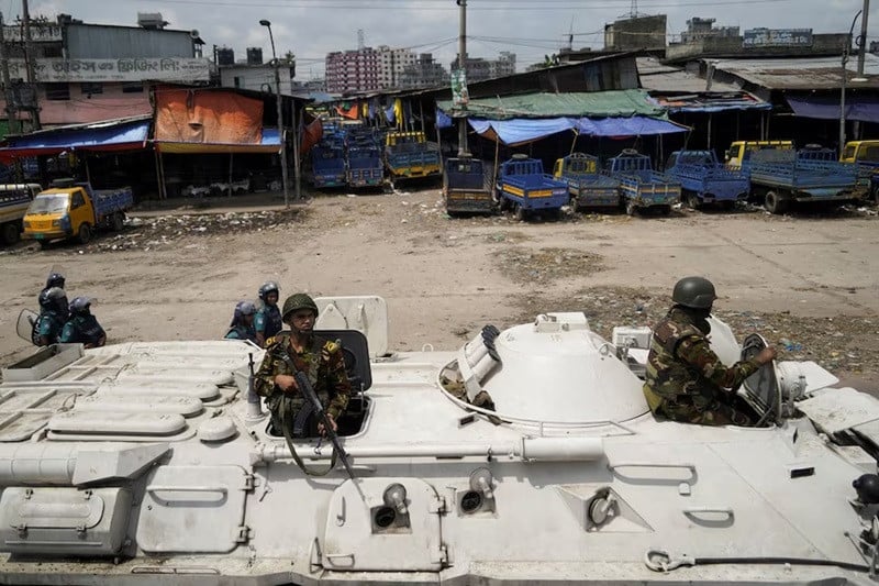 members of the bangladesh army are seen on an armoured vehicle during a imposed curfew in dhaka bangladesh july 20 2024 photo reuters