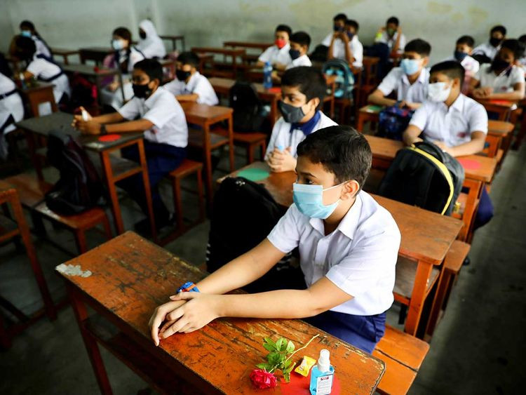 students attend a class after the government withdrew restrictions on educational institutions following a decrease in the number of cases of coronavirus disease covid 19 in dhaka bangladesh september 12 2021 photo reuters