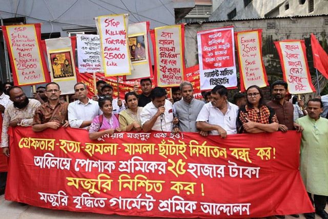 members from garment workers unions protest in front of the minimum wage board office in dhaka on november 7 2023 photo afp members from garment workers unions protest in front of the minimum wage board office in dhaka on november 7 2023 photo afp