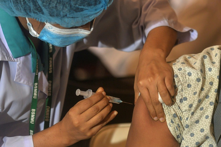 a man is injected with a covid 19 vaccine in dhaka bangladesh photo afp file